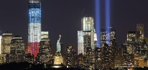 The Tribute in Light is illuminated next to the Statue of Liberty (C) and One World Trade Center (L) during events marking the 11th anniversary of the 9/11 attacks on the World Trade Center in New York, September 10, 2012.  REUTERS/Gary Hershorn (UNITED STATES - Tags: ANNIVERSARY CITYSPACE DISASTER TPX IMAGES OF THE DAY)